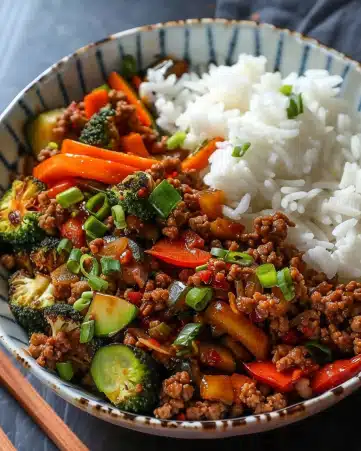 Spicy Ground Beef Stir-Fry Bowl with Garlic Veggies & Steamy Rice