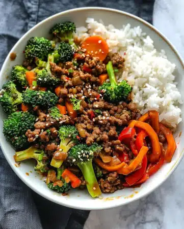 Spicy Ground Beef Stir-Fry Bowl with Garlic Veggies & Steamy Rice