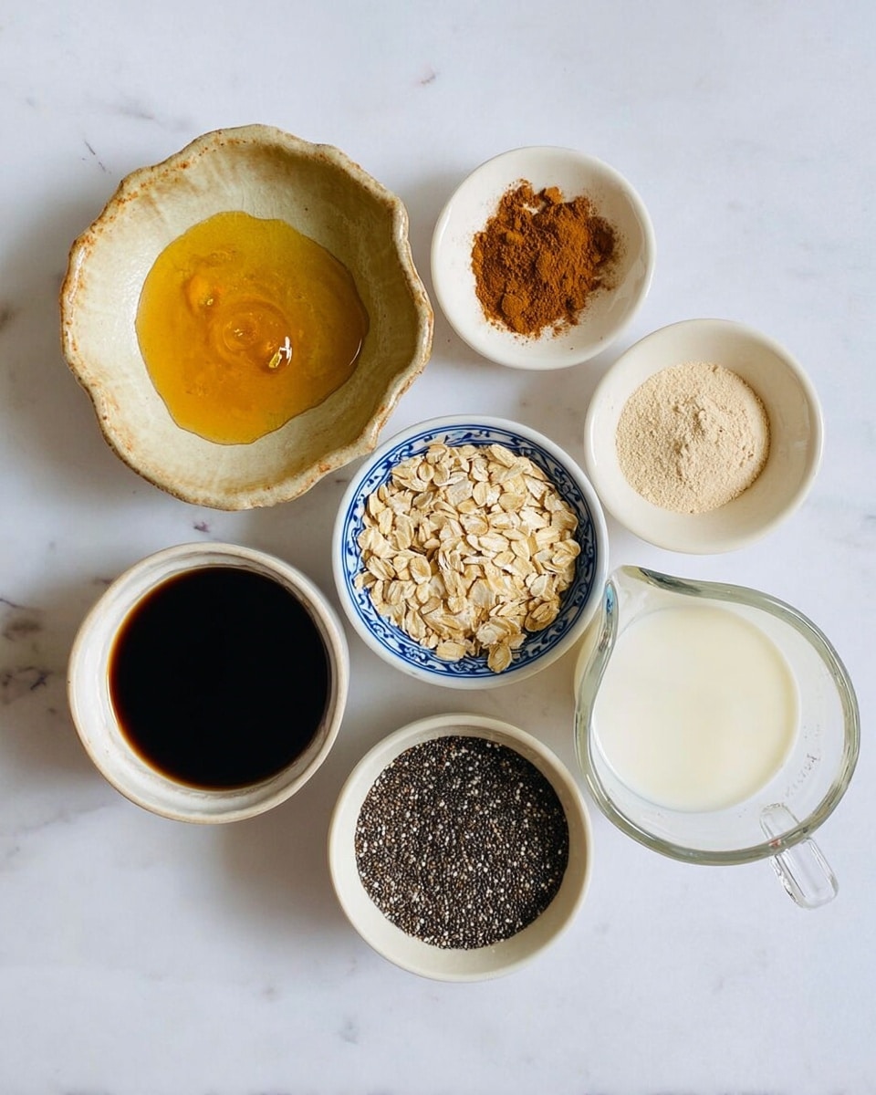 Seven small bowls and a measuring cup are arranged on a white marbled surface. The top left bowl is a beige, uneven ceramic with golden honey and a small pool of dark liquid in the center. To the right, a small white bowl holds a pile of bright brown cinnamon powder. Below the honey bowl is a white bowl with blue patterns, filled with light beige rolled oats. Next to it on the right is a plain white bowl containing light tan powdered substance. At the bottom left, a white bowl with a thin blue rim is filled with dark liquid, and to its right is a white bowl full of black chia seeds with white specks. Finally, a clear glass measuring cup filled with white milk is placed at the bottom right. photo taken with an iphone --ar 4:5 --v 7