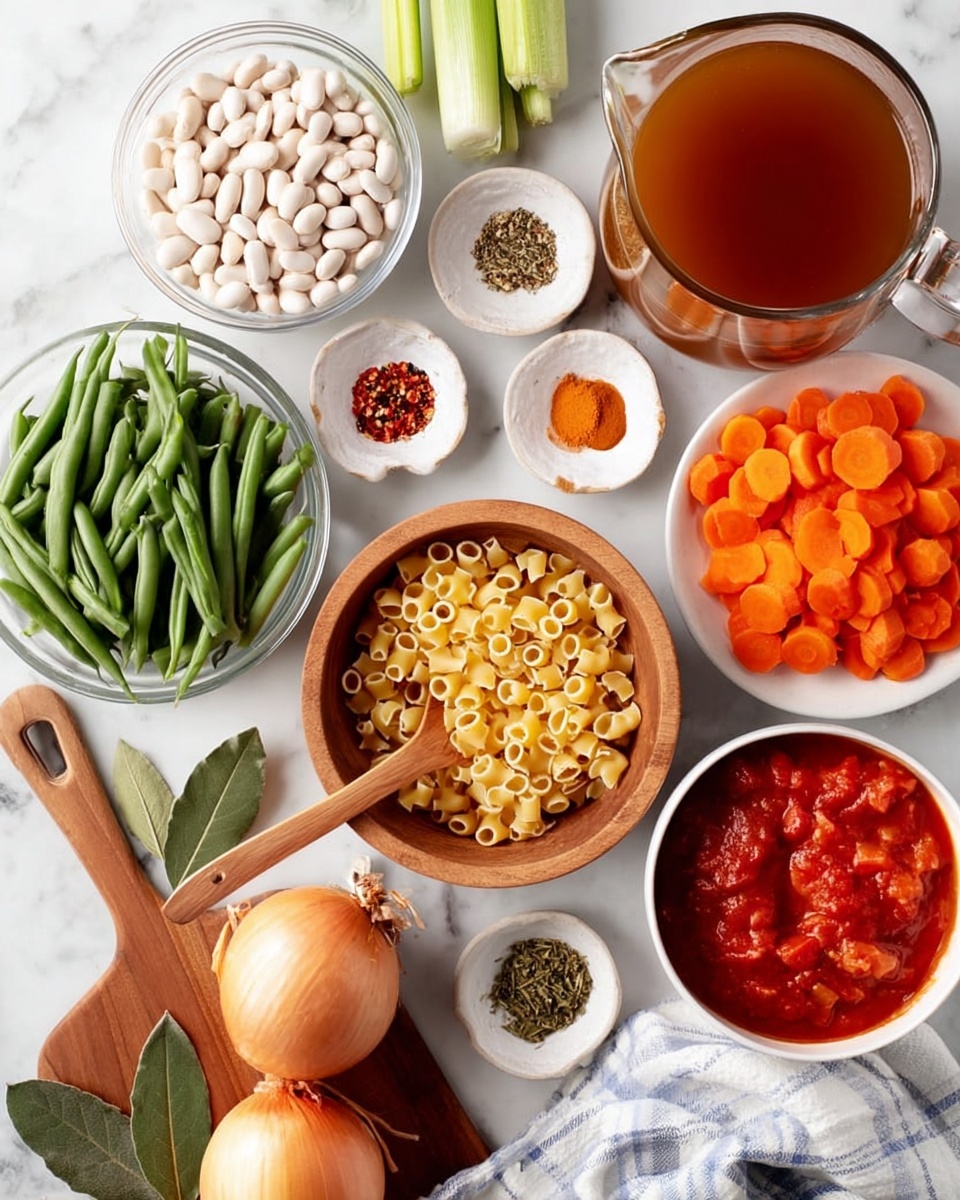 The image shows a white marbled surface with several white and clear bowls filled with different fresh ingredients arranged neatly. In the center is a wooden bowl filled with small round pasta, with a wooden spoon resting inside. To the top left is a clear bowl with white beans, and next to it on the right is a clear glass pitcher filled with brown broth. Below the pitcher is a white bowl packed with bright orange carrot slices. Toward the bottom right, a white bowl holds chunky red tomatoes in sauce. To the left of the wooden bowl are fresh green beans and a large whole onion placed on a wooden chopping board with two bay leaves. There are small white plates and wooden bowls scattered with spices including salt, pepper, red chili flakes, and dried herbs. Celery pieces are held in a clear bowl near the white beans. A white and blue striped cloth is partly visible near the bowls. The whole scene feels organized and fresh, set on the clean white marbled texture. photo taken with an iphone --ar 4:5 --v 7