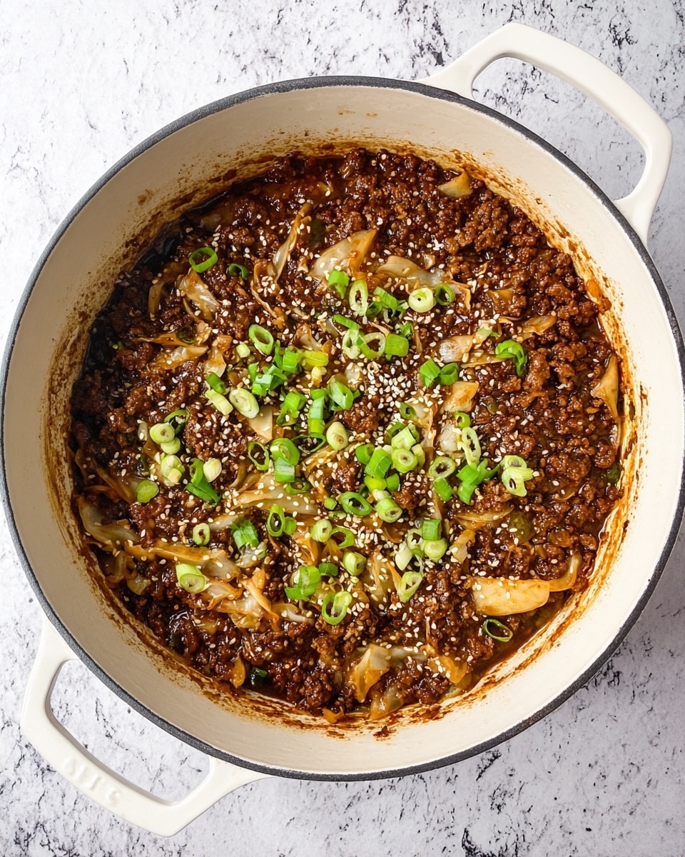 Inside a white pot with two handles, there is a cooked dish made of three main layers visible from above. The bottom layer is a dark brown sauce that looks thick and rich. The middle layer consists of soft, light brown cabbage pieces spread unevenly across the sauce. The top layer is made up of small chunks of cooked ground meat, dark brown in color, sprinkled with white sesame seeds and chopped green onions that add a touch of bright green on top. The pot is placed on a white marbled surface. photo taken with an iphone --ar 4:5 --v 7