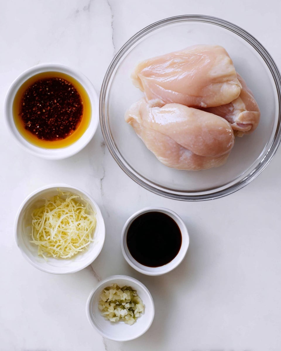 The image shows ingredients arranged on a white marbled surface. There is a clear glass bowl on the right side with two raw, pale pink chicken pieces, smooth in texture and slightly shiny. On the left side, four small white bowls hold different ingredients: the top bowl contains a dark brown liquid with visible small pieces in it, the middle left bowl has a golden amber liquid, the bowl below it is filled with a thick black liquid, and the bottom bowl holds finely shredded pale yellow ginger and light green minced garlic next to each other. The setup is simple and clean, with all items viewed from above, photo taken with an iphone --ar 4:5 --v 7
