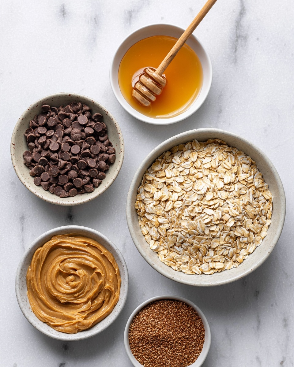 The image shows five white bowls arranged on a white marbled surface. The largest bowl on the right is filled with light brown rolled oats with a dry, flaky texture. Above it, a small white bowl contains honey, golden and smooth, with a wooden honey dipper resting inside. To the left of the honey, another small white bowl is filled with small, dark brown chocolate chips, round and shiny. Below the oats, a white bowl holds creamy, light brown peanut butter with a smooth, thick texture and a spoon resting in it. To the left of the peanut butter, a small white bowl contains a powdery, brown flaxseed meal. The bowls are placed close but not touching each other, all on a white marbled surface. Photo taken with an iphone --ar 4:5 --v 7