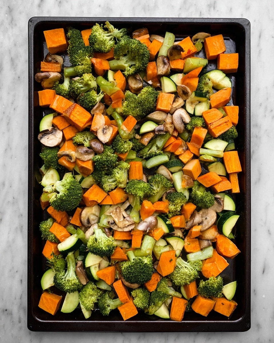 The image shows a single layer of mixed raw vegetables spread evenly on a dark baking tray. The vegetables include bright orange chunks of sweet potato, green broccoli florets, baby carrots, green zucchini pieces with white inside, and light brown sliced mushrooms. The colors of the vegetables create a vibrant and fresh look, with the varied shapes and textures scattered across the tray. The tray sits on a white marbled surface. Photo taken with an iphone --ar 4:5 --v 7