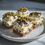 Cannoli Bars with Orange Ricotta Cheesecake, Whipped Cream, Pistachios, and Chocolate Chips Recipe