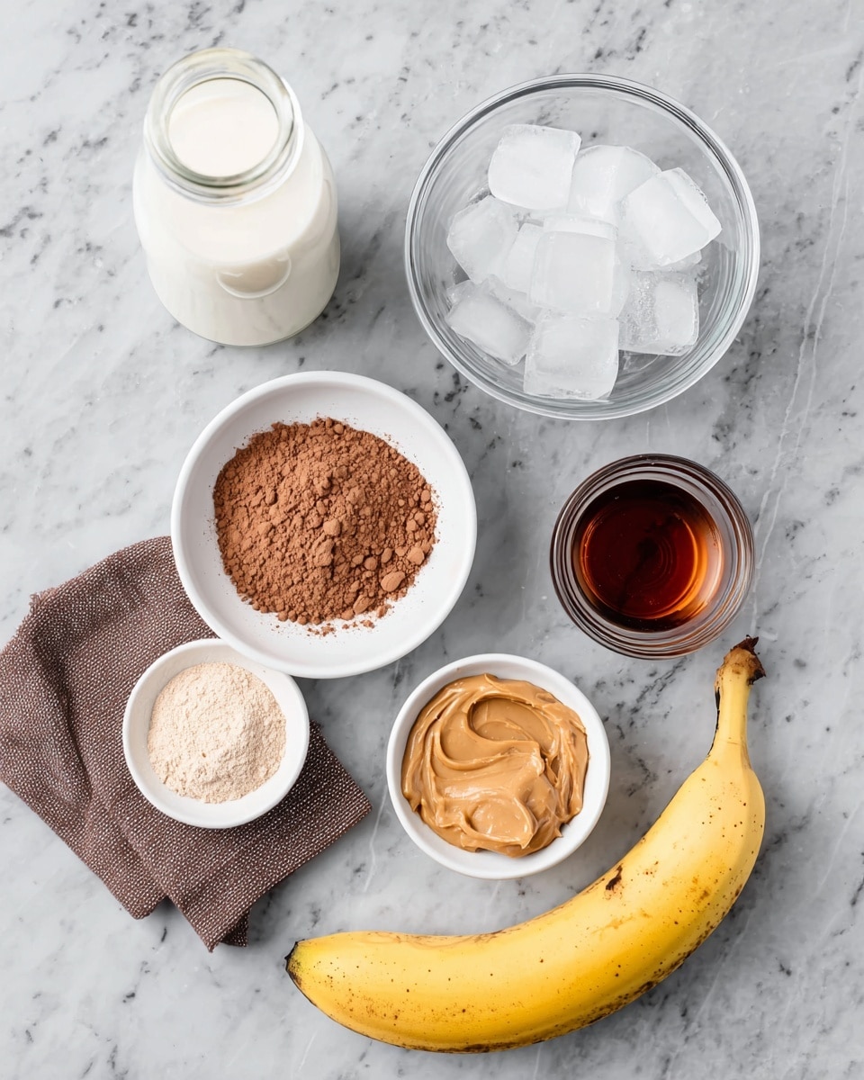 The image shows seven ingredients arranged on a white marbled surface: at the bottom, a whole yellow banana with a slight brown tip on the end; above the banana, a small white bowl filled with brown cocoa powder; to the left of that, a white bowl containing light brown powder; to the right of the powder bowl is a small white bowl with smooth, light brown peanut butter; next to that is a clear glass bowl filled with ice cubes; above the peanut butter is a tall, clear bottle filled with white milk; and to the left of the milk bottle is a small clear glass containing dark amber syrup, with a folded brown cloth napkin near it. Photo taken with an iphone --ar 4:5 --v 7