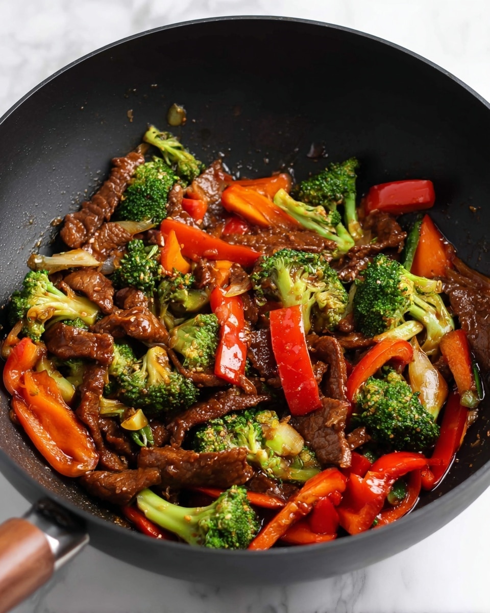 This image shows a black wok filled with a colorful stir-fry. Inside, there are dark brown strips of cooked meat mixed with thick bright green broccoli florets, few thick slices of orange carrots, and large pieces of red bell pepper. The vegetables and meat are coated in a shiny brown sauce. The wok rests on a white marbled surface. photo taken with an iphone --ar 4:5 --v 7