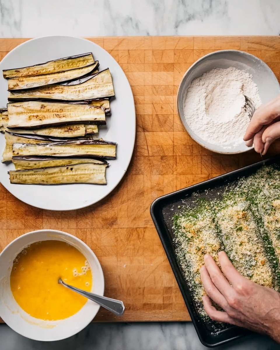 The image shows a wooden table with four main items arranged for cooking. On the left, there is a white plate with long slices of grilled eggplant stacked loosely in two layers, showing a light brown grilled texture with darker grill marks. Next to it, slightly higher, there is another white plate full of white flour with a fork resting on it. Below this is a white bowl filled with beaten eggs, bright yellow-orange in color, with a fork placed inside. On the right side of the table, there is a black tray with a layer of bread crumbs mixed with green herbs, evenly spread out. A woman’s hand is seen on the edge of the tray, lightly touching the bread crumbs with her fingers. The background surface is a white marbled texture. Photo taken with an iphone --ar 4:5 --v 7