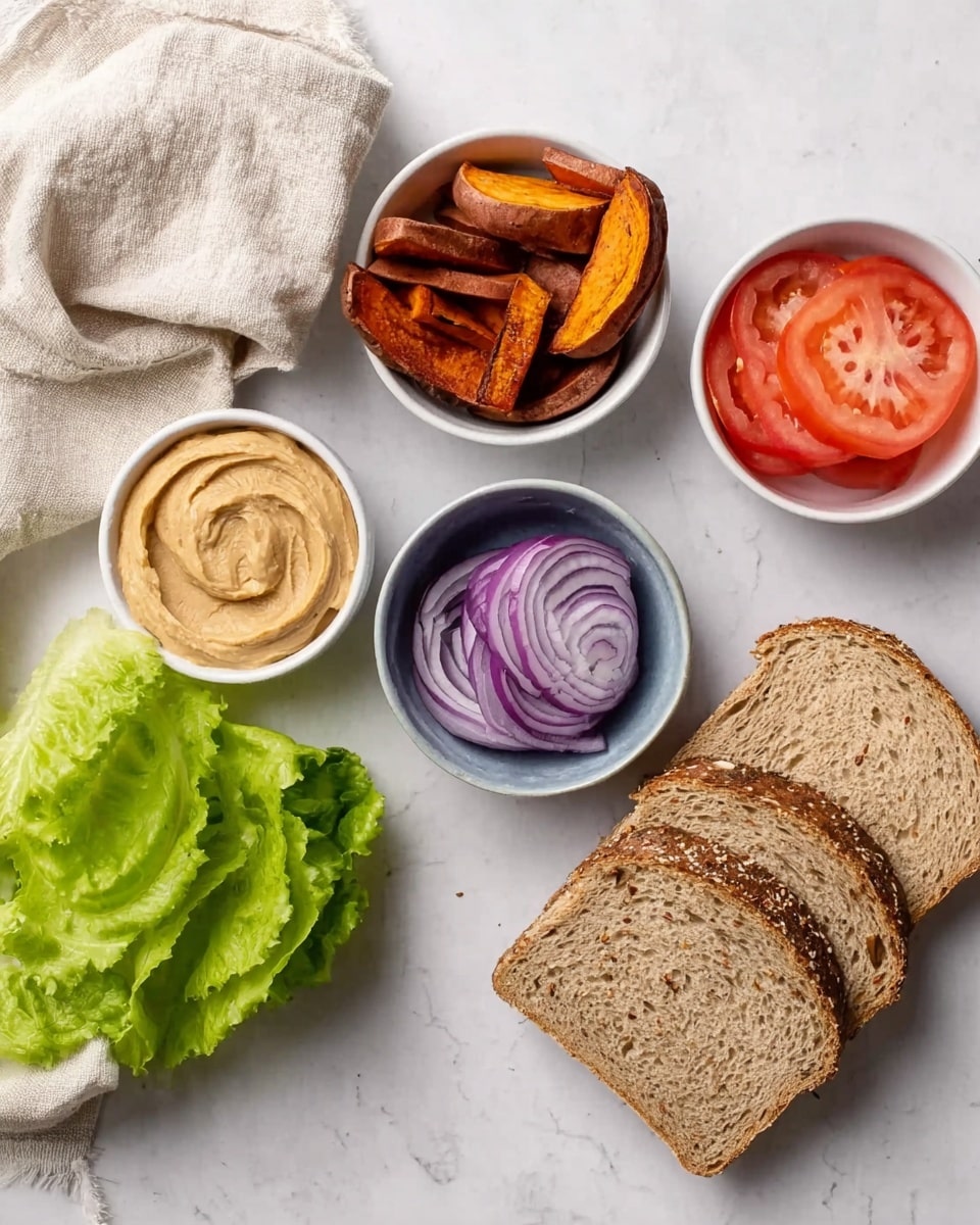This image shows several food items arranged on a white marbled surface. There are four small white bowls each holding different items: one with brown roasted sweet potato slices, one with a light brown creamy spread, one with purple sliced red onion rings, and one with red tomato slices. To the right of these bowls is a small pile of green fresh lettuce leaves, and below that are three slices of brown seed-filled bread stacked together. A light beige cloth is placed loosely on the upper left corner of the scene. Photo taken with an iphone --ar 4:5 --v 7