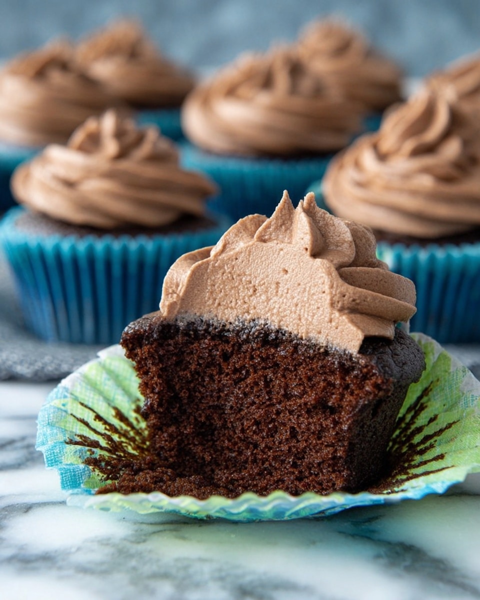 A close-up view of a bowl with creamy potato salad inside. The salad has chunky, yellowish potato pieces mixed with small green celery bits, all coated in a smooth, light-colored dressing. Some dark red seasoning is sprinkled on top along with bright green parsley leaves for contrast. The bowl is white and has a shiny metal spoon resting on the side of the salad. The bowl sits on a wooden surface next to a white and red striped cloth, with a white marbled texture in the background. photo taken with an iphone --ar 4:5 --v 7