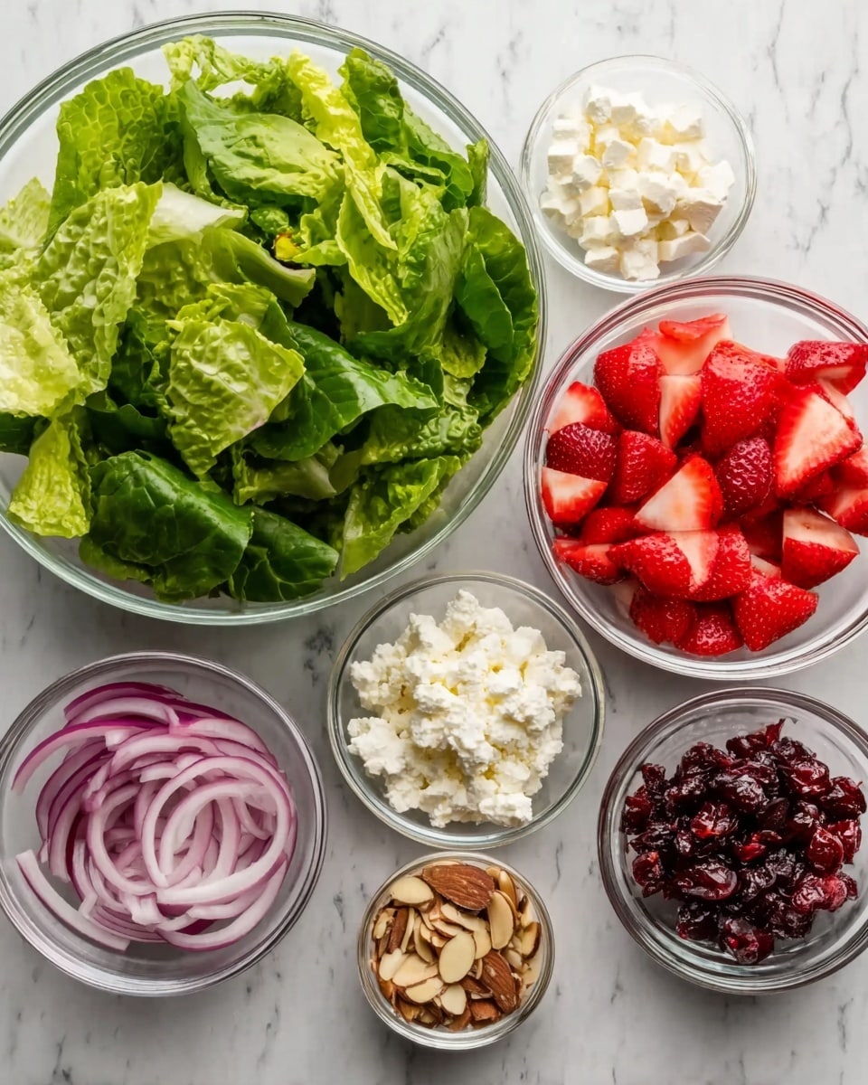 The image shows five small clear glass bowls arranged on a white marbled surface. The largest bowl at the back left is filled with fresh green romaine lettuce leaves, roughly torn. To the right of it, there is a bowl of bright red sliced strawberries, cut into halves and quarters. In front, a medium bowl holds thin slices of purple-red onion. On the left side, a small bowl contains light brown sliced almonds, and next to it on the right is a bowl of small white cottage cheese curds. The final bowl on the front right is filled with dark red dried cranberries. The bowls are spaced evenly, showing the vibrant colors and textures of each ingredient clearly, photo taken with an iphone --ar 4:5 --v 7
