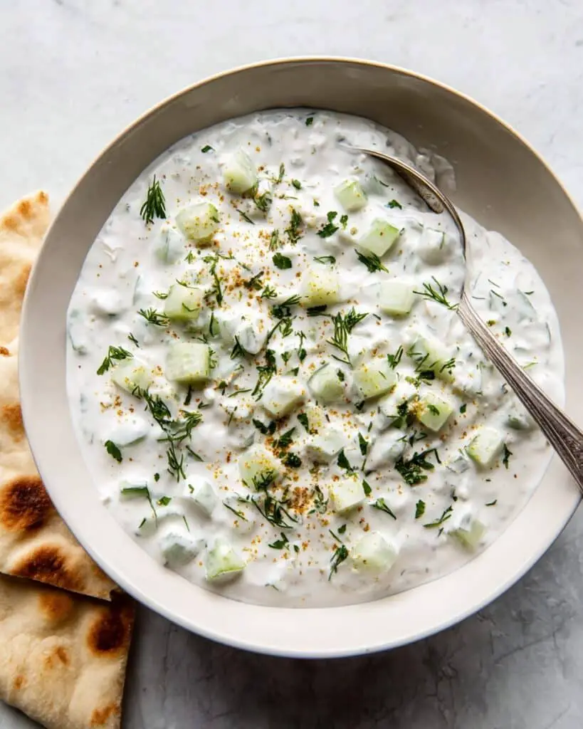 Easy Raita Recipe with Greek Yogurt, Cucumber, and Spices Recipe