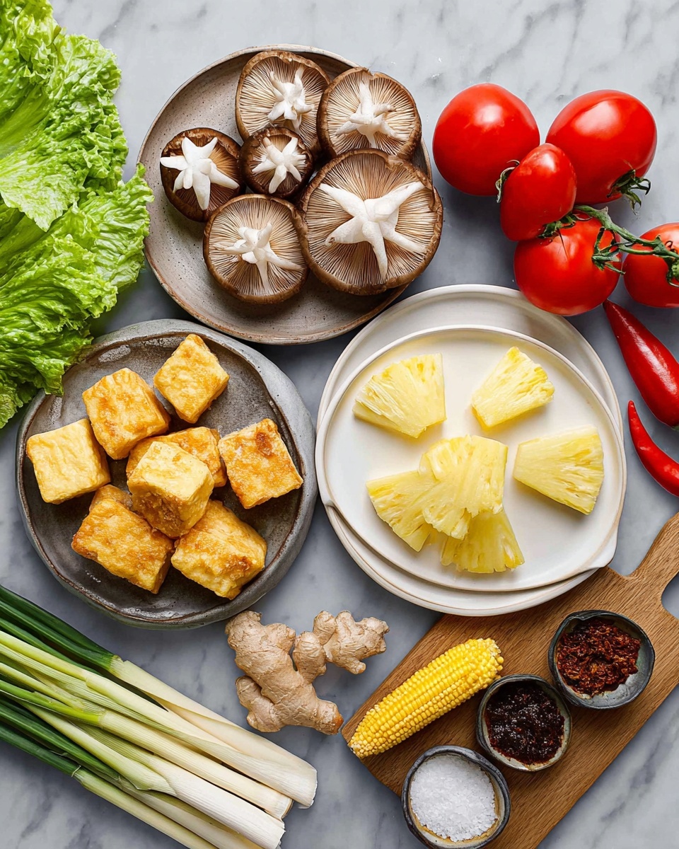 The image shows fresh ingredients arranged on a white marbled surface. There is a plate with a cluster of brown shimeji mushrooms at the top left, and below it, three brown shiitake mushrooms each with white star-shaped patterns on top. In the center, a plate filled with yellow-white pineapple wedges is placed. To the right, a white plate holds five golden-yellow fried tofu cubes. Around these plates, there are green lettuce leaves on the top left, red chili pepper, two pale green lemongrass stalks lying next to small yellow baby corns, a piece of light brown ginger, and three bright red tomatoes with green stems attached. On the right side, a wooden board supports small bowls of dark brown paste and white granulated seasoning. The colors are fresh and vibrant, contrasting well with the white marbled background. Photo taken with an iphone --ar 4:5 --v 7