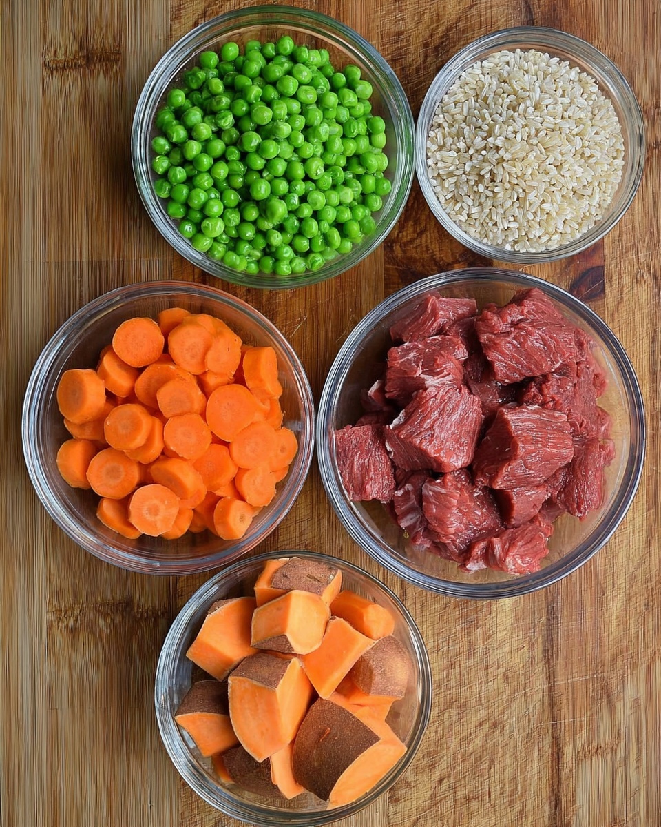 Five clear glass bowls are arranged on a wooden surface, each holding a different ingredient. The top left bowl contains bright green peas, slightly shiny and round. The top middle bowl holds raw red beef pieces with a rough texture. To the right, a bowl is filled with light tan uncooked rice grains. The bottom left bowl contains sliced orange carrots with visible rings. Lastly, the bottom middle bowl has chunks of orange sweet potatoes with brown skin. Photo taken with an iphone --ar 4:5 --v 7