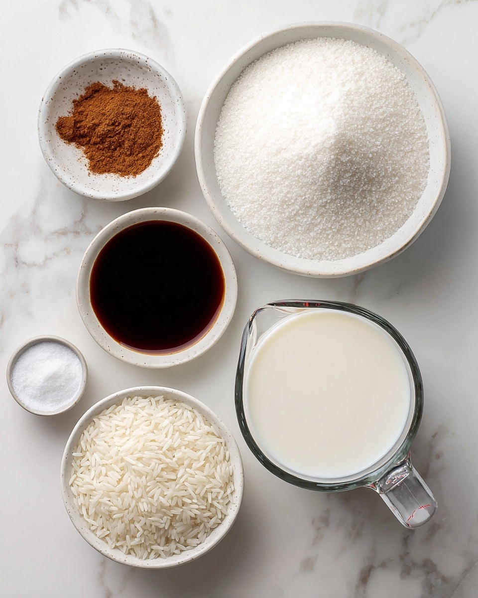 The image shows six containers with ingredients on a white marbled surface: a large clear glass measuring cup filled with white liquid (probably milk) is in the lower right corner; a white bowl with uncooked white rice sits near the bottom center; a large white bowl filled with white granulated sugar is near the top right; a small white bowl with dark brown liquid (likely vanilla extract) is to the left of the sugar bowl; a small white bowl holding brown powdered spice (likely cinnamon) is placed between the sugar and vanilla bowls; and a small white bowl with white powder (probably salt) is at the lower left next to the vanilla bowl. photo taken with an iphone --ar 4:5 --v 7