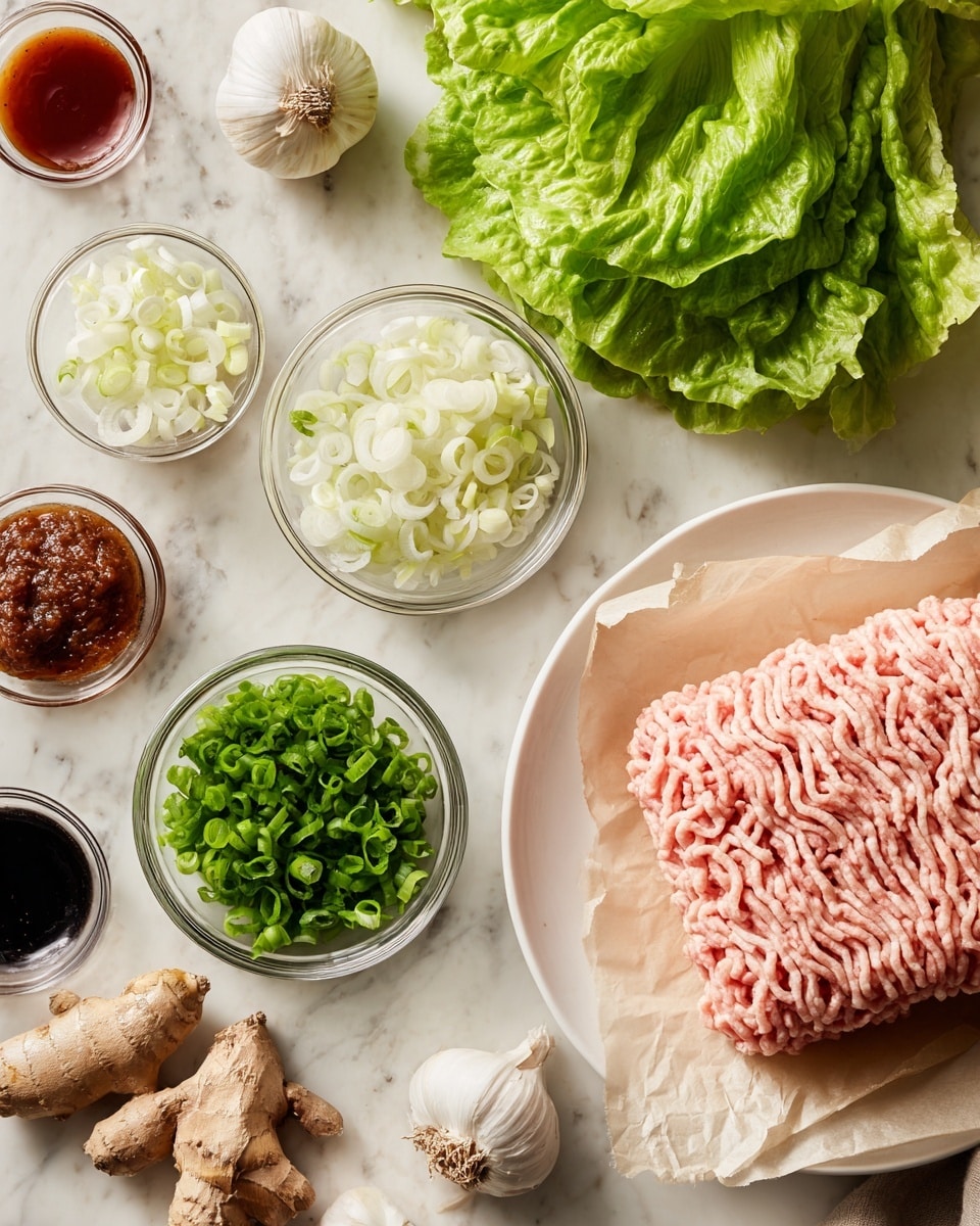 The image shows fresh cooking ingredients on a white marbled surface. On the right, there is a white plate holding a thick layer of light pink ground meat lined with beige parchment paper. Around the plate, there are several small clear glass bowls filled with finely chopped white onions, bright green sliced green onions, and whole white garlic cloves. There is a cluster of fresh bright green leafy lettuce on the left side. Also visible are small bowls with dark brown and reddish sauces, along with some pieces of fresh ginger root. photo taken with an iphone --ar 4:5 --v 7