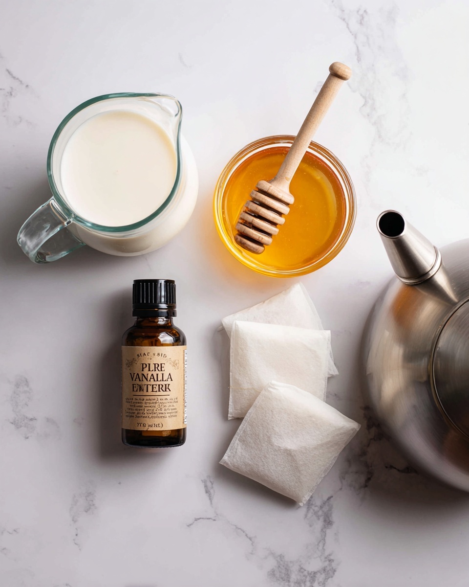 A layout of ingredients and utensils on a white marbled surface shows a clear glass pitcher of milk on the bottom left; next to it is a small amber bottle labeled