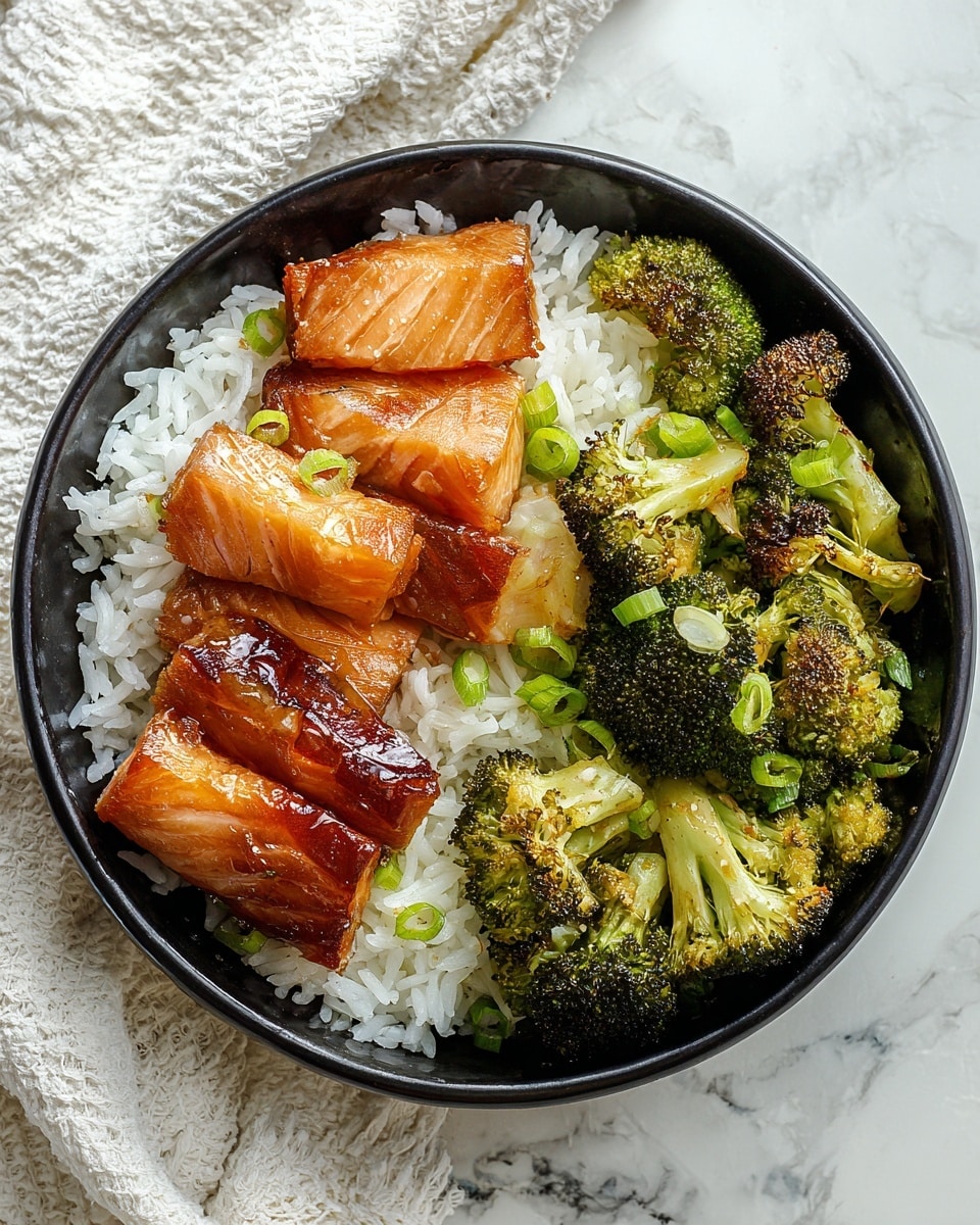 In a black bowl, there is a bottom layer of white rice with individual grains visible, topped on the left side with thin, glossy, golden-brown and white smoked fish slices arranged in a slightly overlapping pattern. On the right side, there are bright green broccoli florets with a slightly roasted texture and some small browned spots. Small green onion slices are scattered on the fish pieces and rice. The bowl is placed on a white marbled surface with a textured white cloth partially visible at the top left corner. Photo taken with an iphone --ar 4:5 --v 7